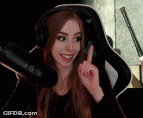 Woman With Headphones Pointing Upwards At Microphone GIF
