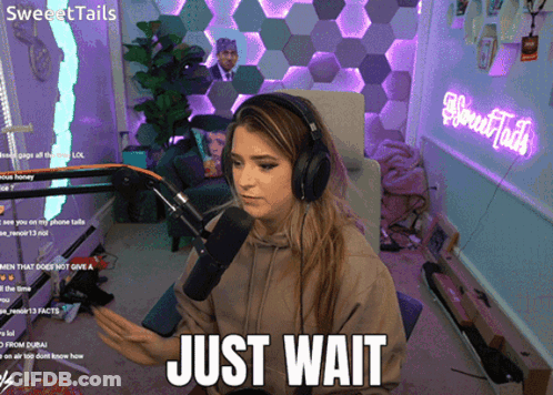 Woman With Headphones Saying Just Wait GIF