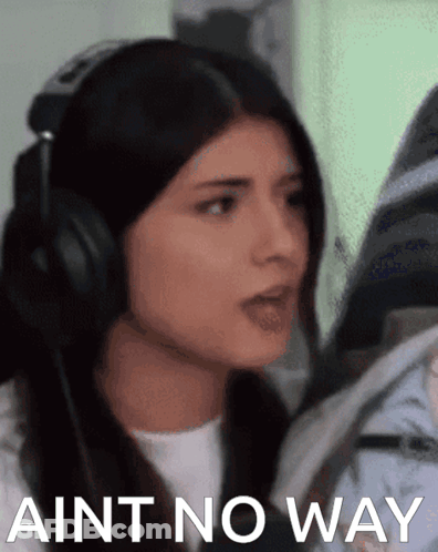 Woman With Headphones Says Ain't No Way In Front Of Clock GIF