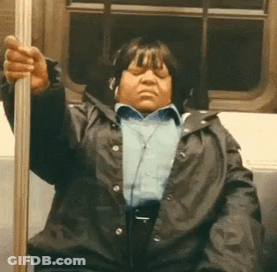 Woman With Headphones Sitting On Train GIF