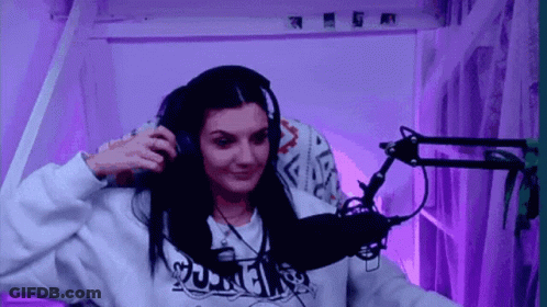 Woman With Headphones Smiling At Microphone GIF