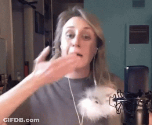 Woman With Headphones Talking Into Microphone Holding Stuffed Animal GIF