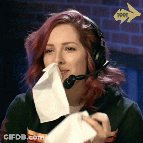 Woman With Headset Blowing Nose GIF