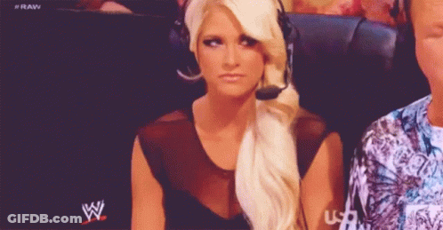 Woman With Headset In Front Of WWE Logo GIF