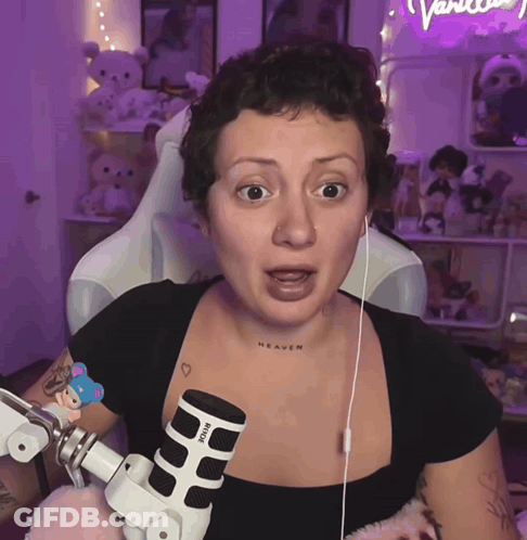 Woman With Heaven Neck Tattoo In Front Of Rode Microphone GIF