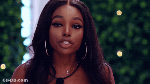 Woman With Hoop Earrings And Letter J On Neck GIF