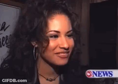Woman With Hoop Earrings And Necklace Close Up GIF
