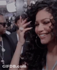 Woman With Hoop Earrings And Nose Ring Smiling GIF