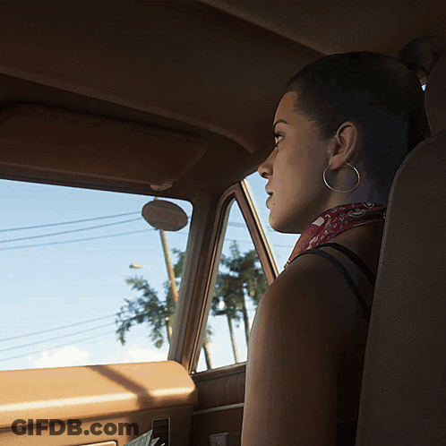 Woman With Hoop Earrings Sits In Car GIF