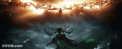 Woman With Horns And Green Cape In Front Of Birds GIF