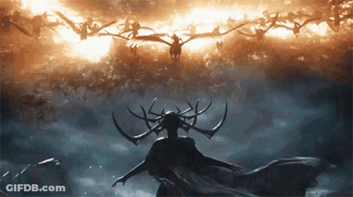 Woman With Horns Standing In Front Of Flock Of Birds GIF