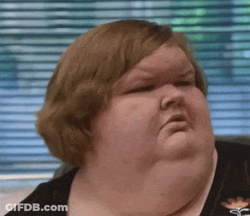 Woman With Large Neck Making Funny Face GIF