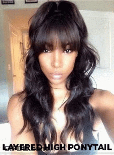 Woman With Layered High Ponytail Taking Selfie GIF