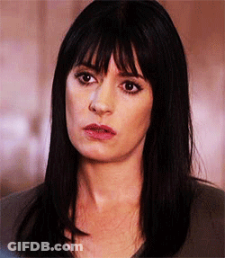 Woman With Long Black Hair And Bangs GIF