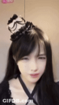 Woman With Long Black Hair And Black White Hat GIF