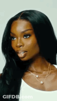 Woman With Long Black Hair And Nose Ring In White Tank Top GIF
