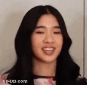 Woman With Long Black Hair And Pink Shirt GIF