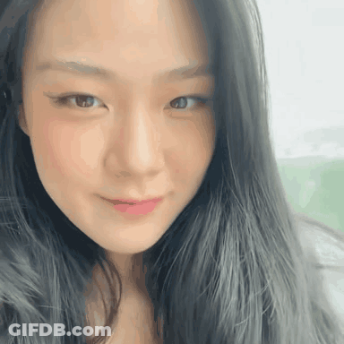 Woman With Long Black Hair Close Up GIF