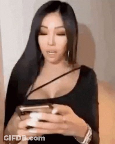 Woman With Long Black Hair Holding Cell Phone GIF