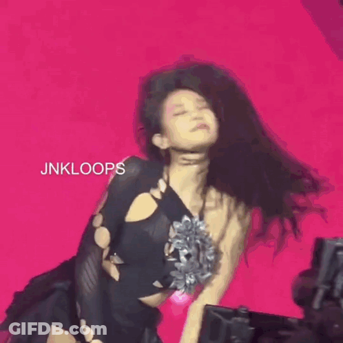 Woman With Long Black Hair Holding Microphone GIF