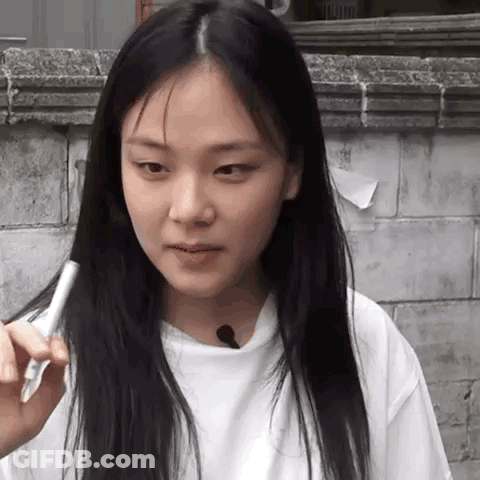 Woman With Long Black Hair Holding Pen GIF