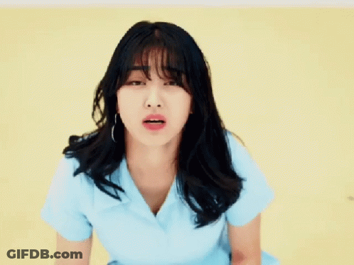 Woman With Long Black Hair In Blue Shirt GIF