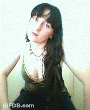 Woman With Long Black Hair In Plunging Top GIF