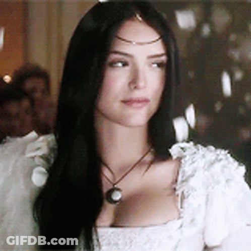 Woman With Long Black Hair In White Dress And Necklace GIF