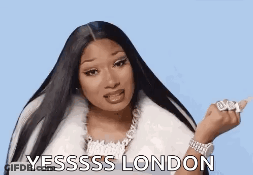Woman With Long Black Hair In White Fur Coat And Necklace Giving Middle Finger GIF