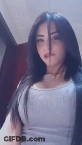 Woman With Long Black Hair In White Tank Top GIF