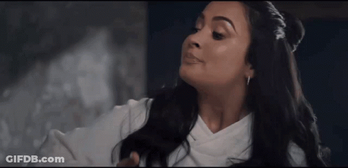 Woman With Long Black Hair In White Top GIF