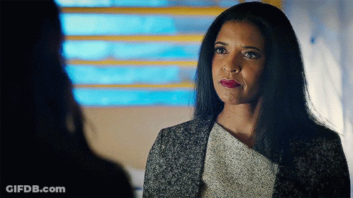 Woman With Long Black Hair Looking At Another Woman GIF