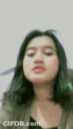 Woman With Long Black Hair Making Funny Face GIF