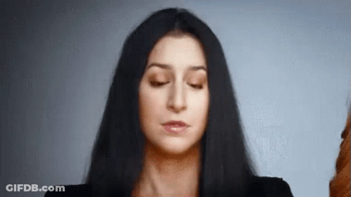 Woman With Long Black Hair Making Funny Face GIF