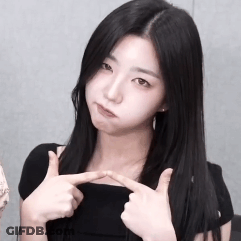 Woman With Long Black Hair Making Funny Face With Fingers GIF