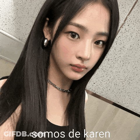 Woman With Long Black Hair, Necklace And Earrings Says Somos De Karen GIF