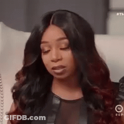 Woman With Long Black Hair Sitting On Couch GIF