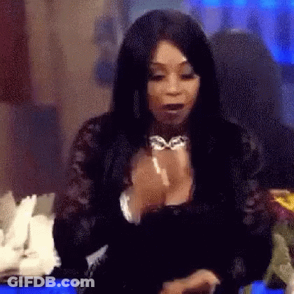 Woman With Long Black Hair Sitting With Hands Folded GIF