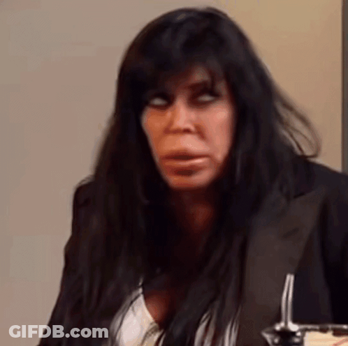 Woman With Long Black Hair Sitting With Spoon GIF