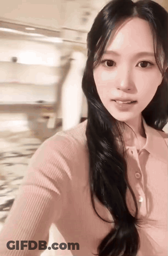 Woman With Long Black Hair Taking Selfie GIF