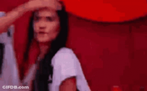 Woman With Long Black Hair Touched By Man's Hand On Forehead GIF