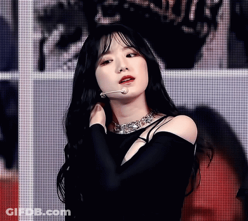 Woman With Long Black Hair Wearing Necklace GIF
