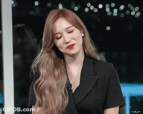 Woman With Long Blonde Hair And Black Shirt GIF