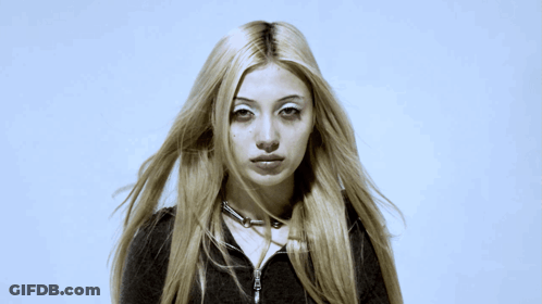 Woman With Long Blonde Hair And Choker Necklace GIF