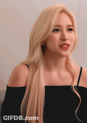 Woman With Long Blonde Hair In Black Off Shoulder Top GIF