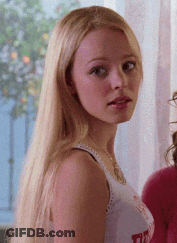 Woman With Long Blonde Hair In White Tank Top Saying TD GIF