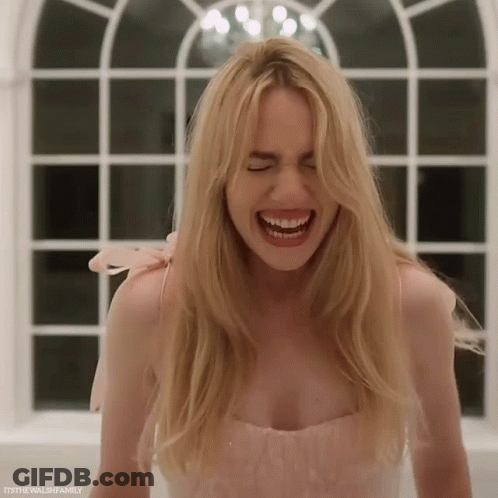 Woman With Long Blonde Hair Laughing Eyes Closed GIF