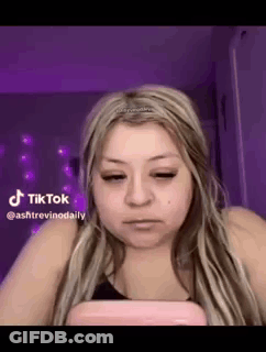 Woman With Long Blonde Hair Looking At Phone GIF