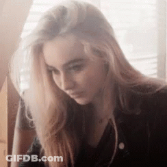 Woman With Long Blonde Hair Looking Down GIF