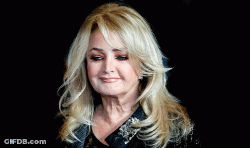Woman With Long Blonde Hair On Black Background GIF